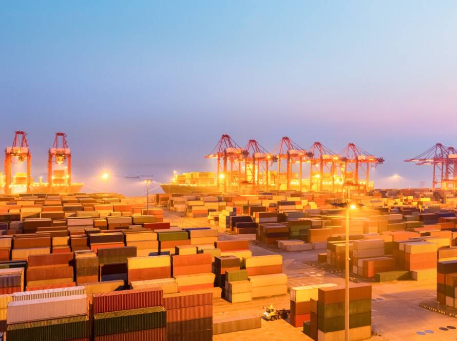 container wharf in nightfall, international import and export trade background